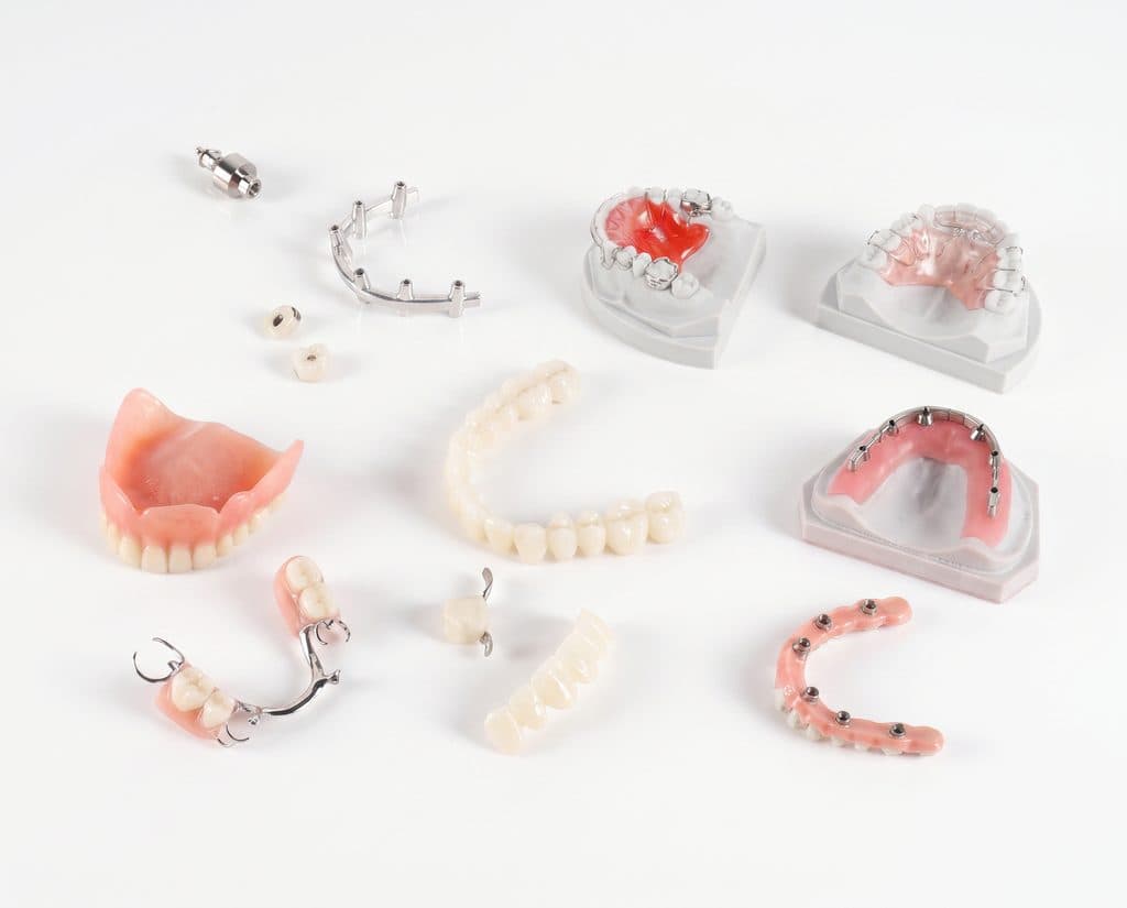 Dental laboratory services including dentures, partials, crowns, and custom restorations